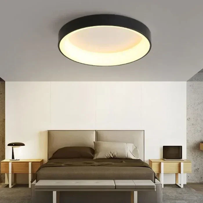 Sleek Scandinavian round LED ceiling light fixture. Modern lighting solution for minimalist interior design.