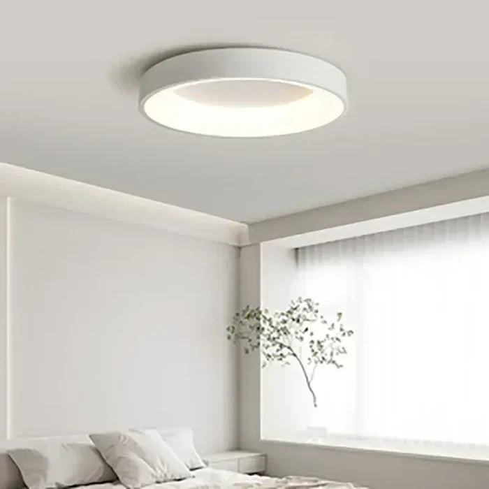 Minimalist modern round LED ceiling lamp. Enhances home decor with soft, energy-efficient ambient light.