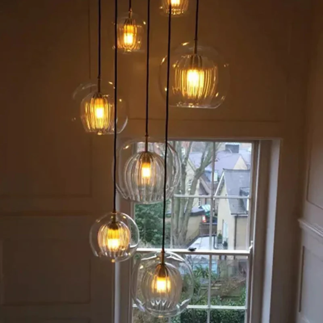 Warm white LED spherical pendant, Aurora Sphere. Perfect for a cozy living room ambiance.