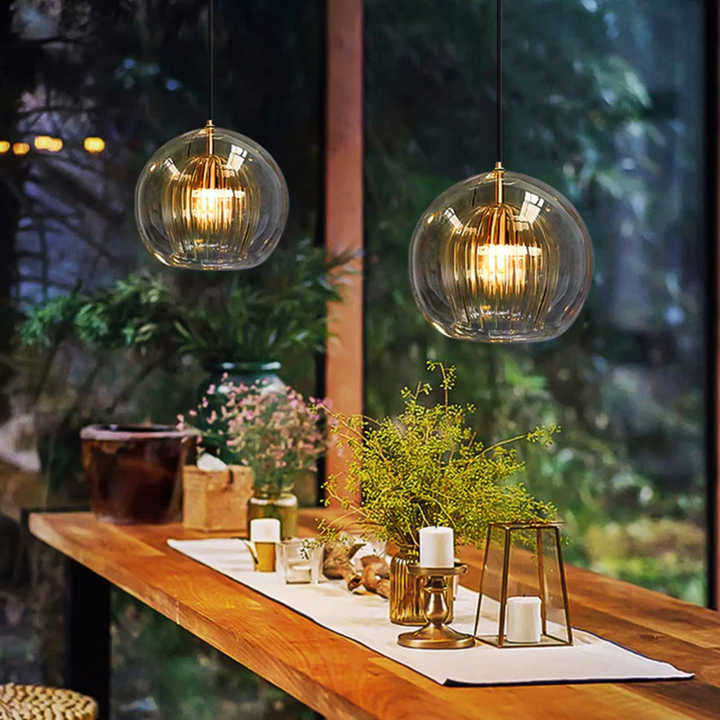 Enhance your home with Aurora Sphere, a modern spherical LED pendant light. Warm white glow.