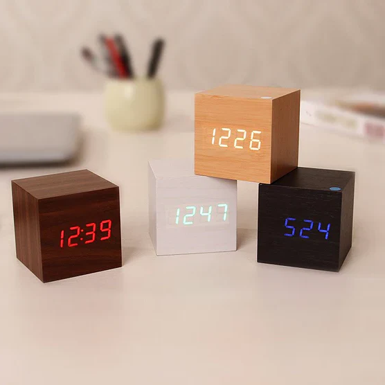 Modern wood digital desk clock with hidden LED display. Minimalist office decor for contemporary homes.