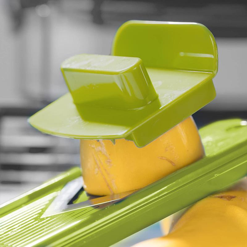 Efficient kitchen accessory: vegetable slicer for quick, uniform cuts & chopping food prep.