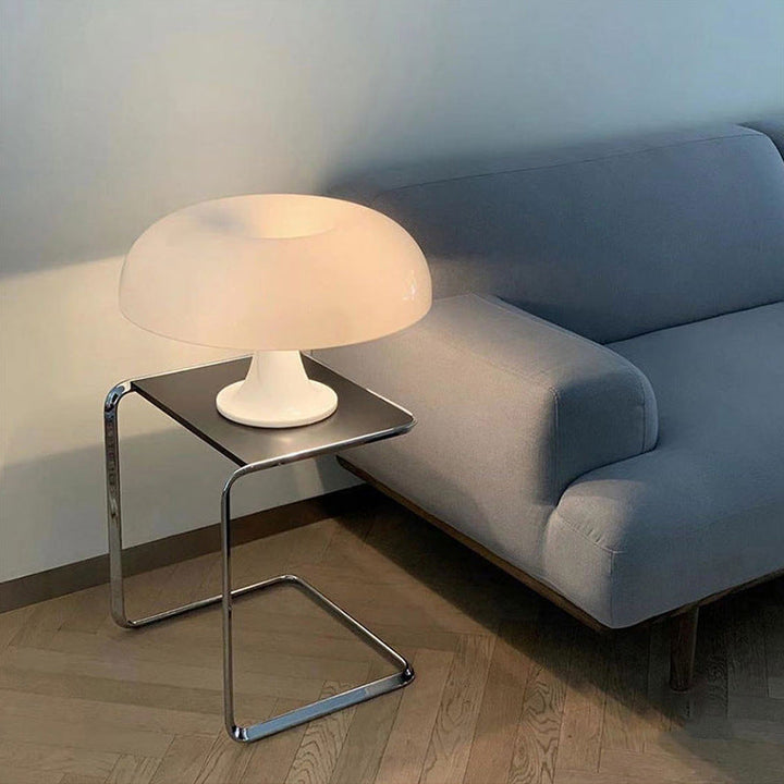 "Mushroom-shaped minimalist table lamp with LED, Nordic design, in white and orange; perfect for modern interiors."