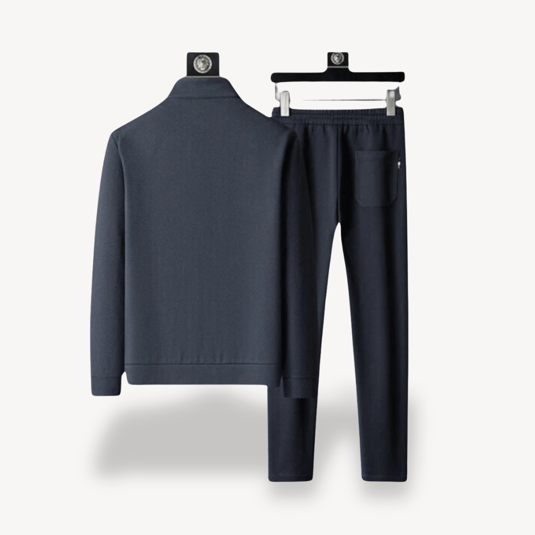 "Navy and black men's tracksuit set with zip jacket and joggers, showcasing sleek design and comfort for casual or gym wear."