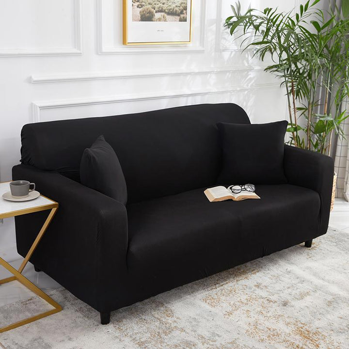 "Noir stretchable sofa cover in solid color, showcasing sleek fit and elegant style for versatile home decoration."