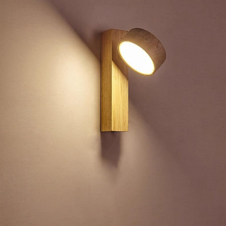 "Off-white travertine wall lamp with LED light, minimalist design, wood accents, ideal for ambient bedroom lighting."