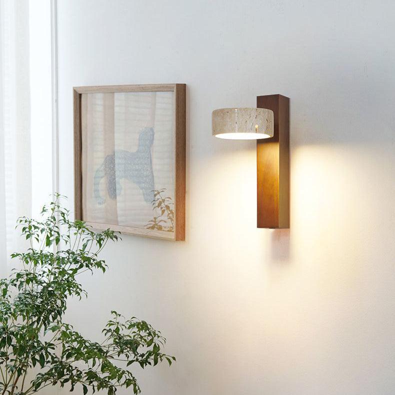 "Off-white travertine wall lamp with LED light, minimalist design, wood accents, ideal for ambient bedroom lighting."