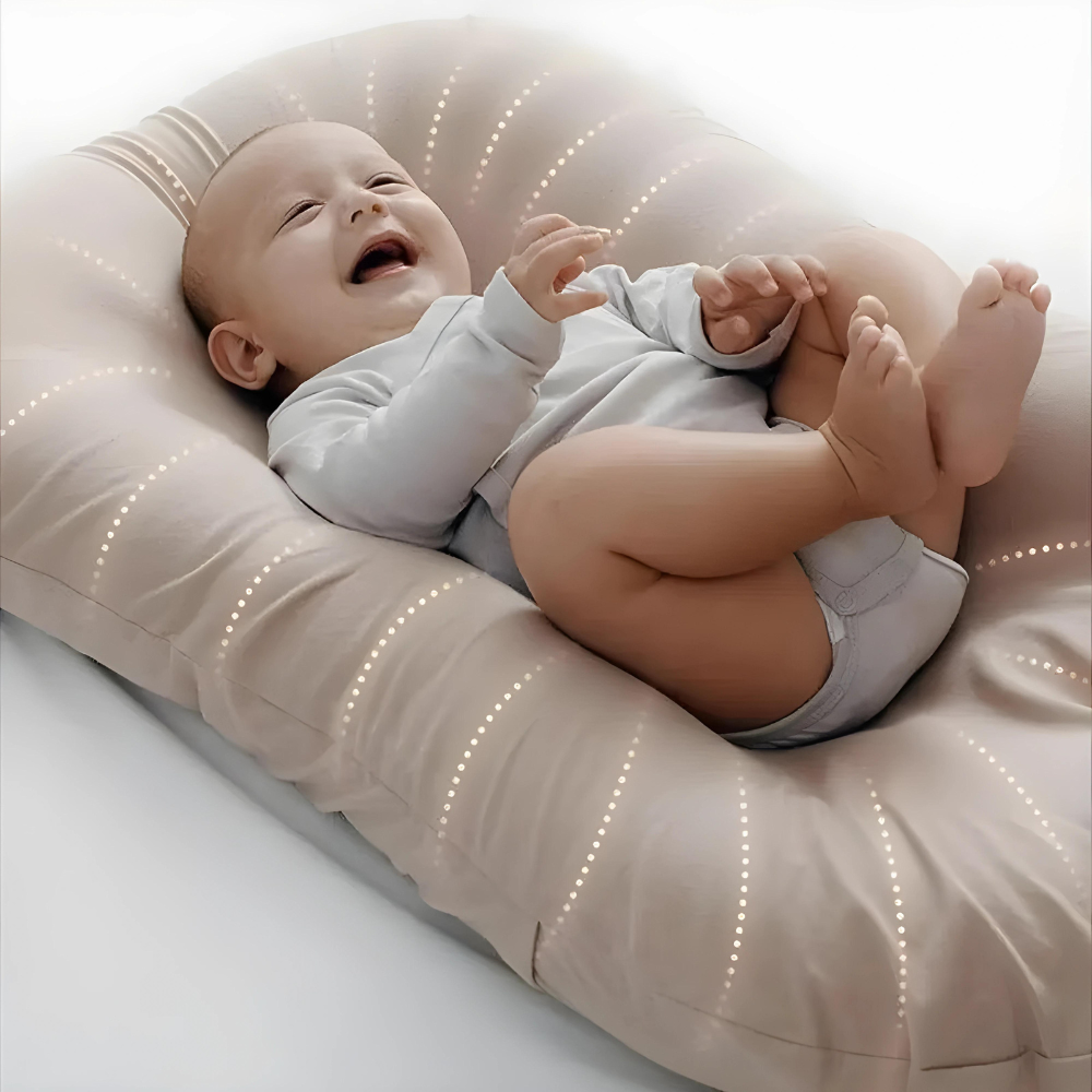 Orthopedic baby cushion in pink, supportive ergonomic design for healthy sleep, prevents flat head syndrome, soft material.