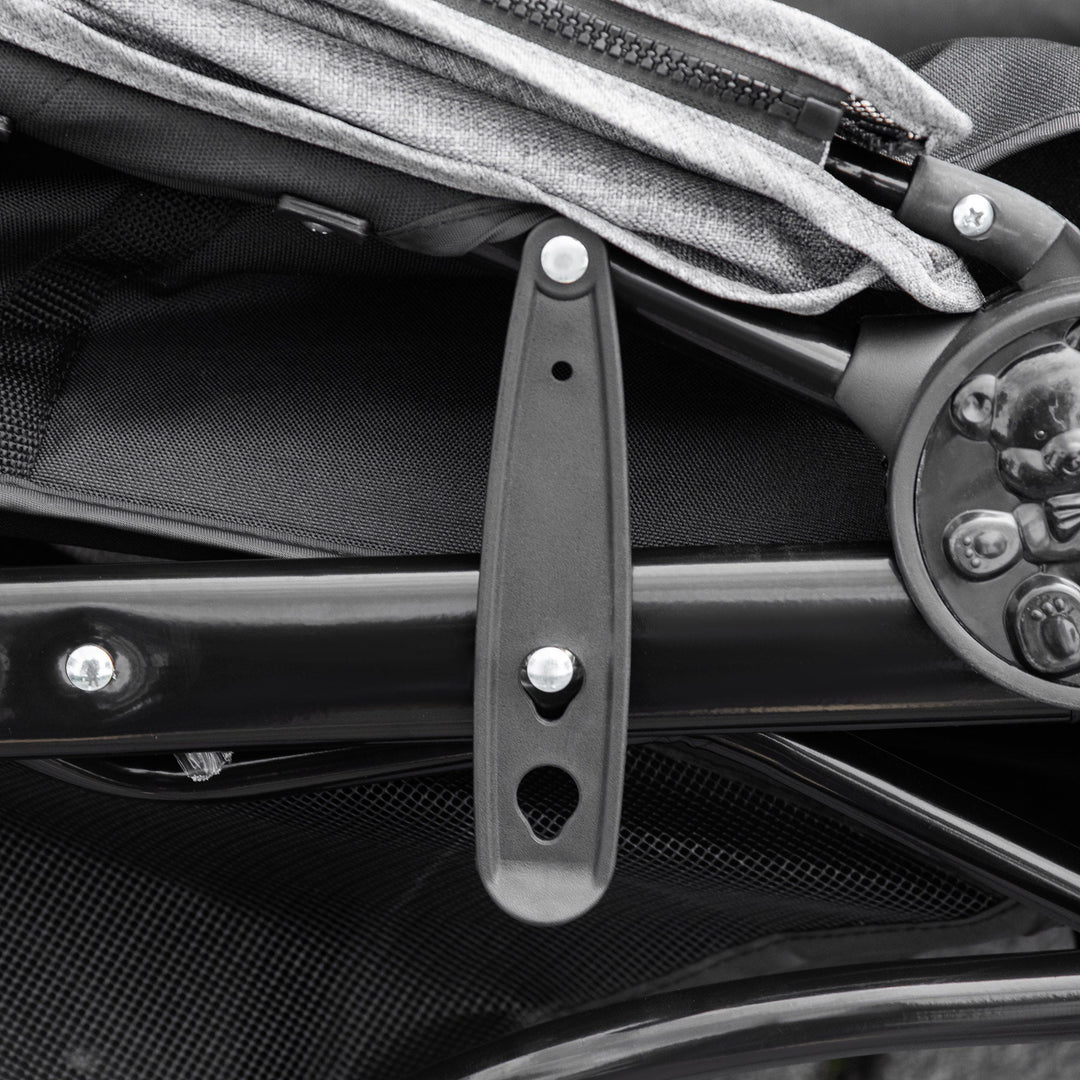 "Outdoor Adventure dog stroller with sturdy wheels, foldable design, and storage basket for pet supplies on any terrain."