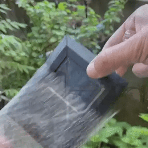 Outdoor Solar LED Wall Light with soft white glow, mounted on patio wall, weather-resistant, perfect for gardens and pathways