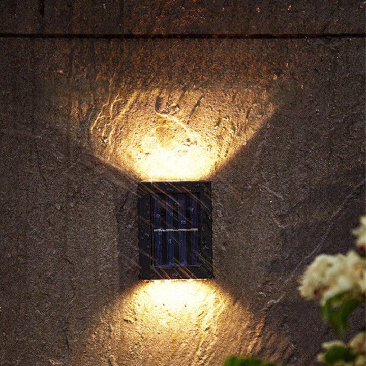 Outdoor Solar LED Wall Light with soft white glow, mounted on patio wall, weather-resistant, perfect for gardens and pathways