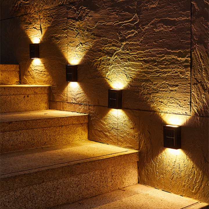 Outdoor Solar LED Wall Light with soft white glow, mounted on patio wall, weather-resistant, perfect for gardens and pathways