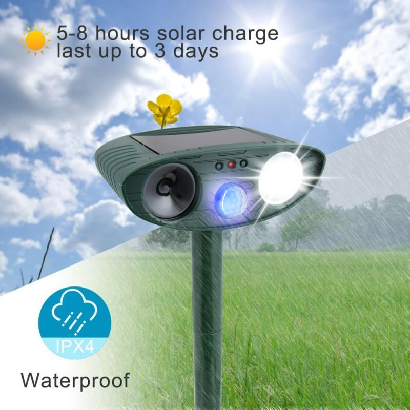 Outdoor solar ultrasonic cat repeller for gardens; eco-friendly device with motion sensors, green and black with solar panel.