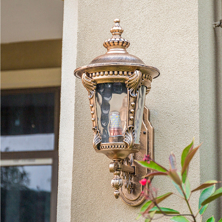 "Outdoor vintage glass wall lantern with aluminum frame, ideal for gardens, porches, providing warm and stylish ambiance."
