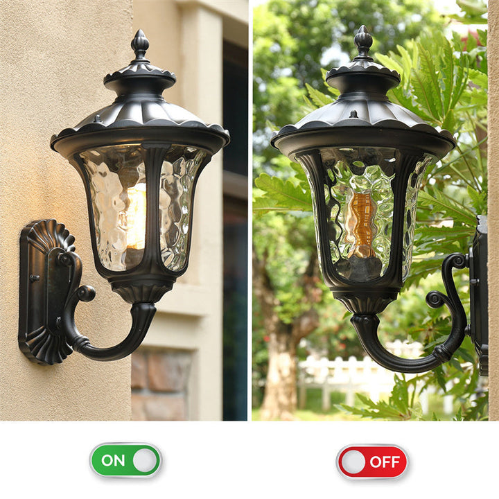 "Outdoor waterproof bronze wall light with clear water glass shade, elegant design for stylish exterior lighting."