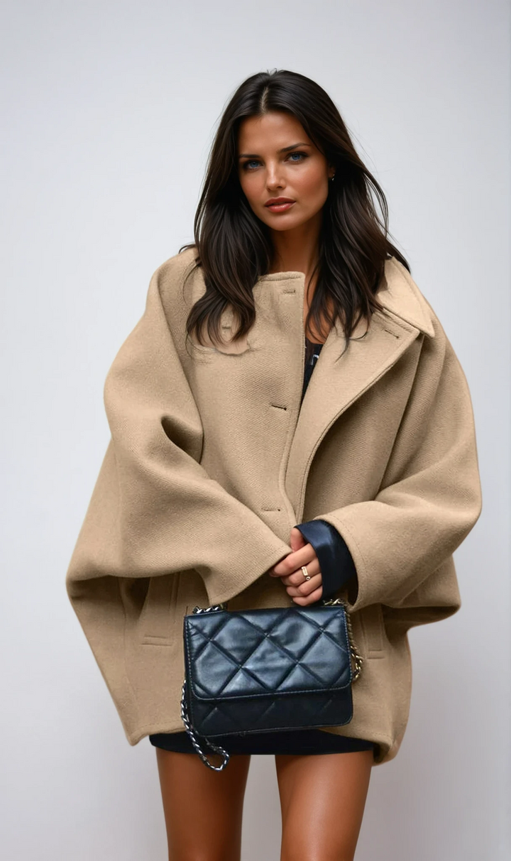 Oversized women's fall coat with button closure, offering effortless style for layering & warmth.