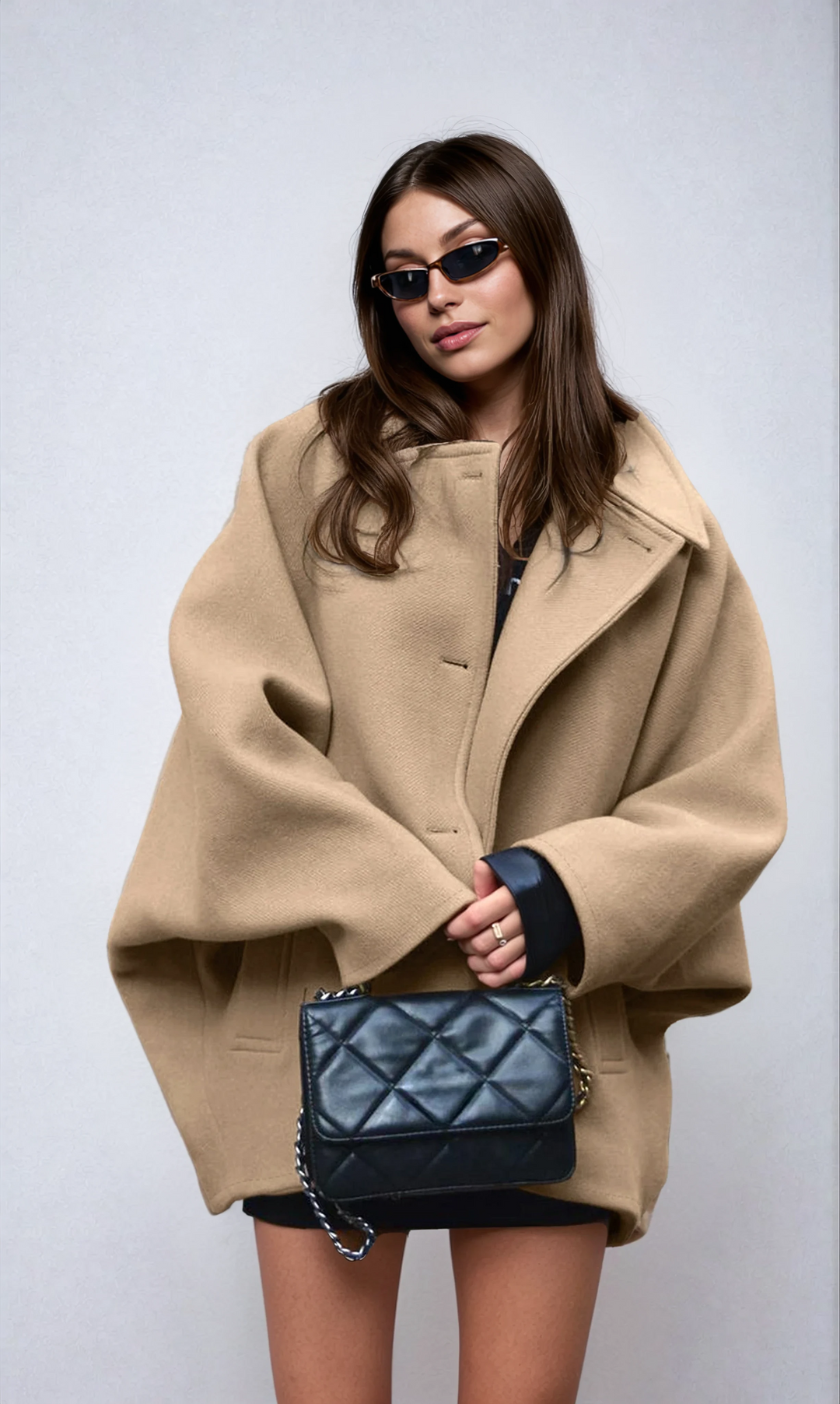 Chic women's oversized long coat with button closure. Perfect relaxed fit outerwear for fall & winter fashion.
