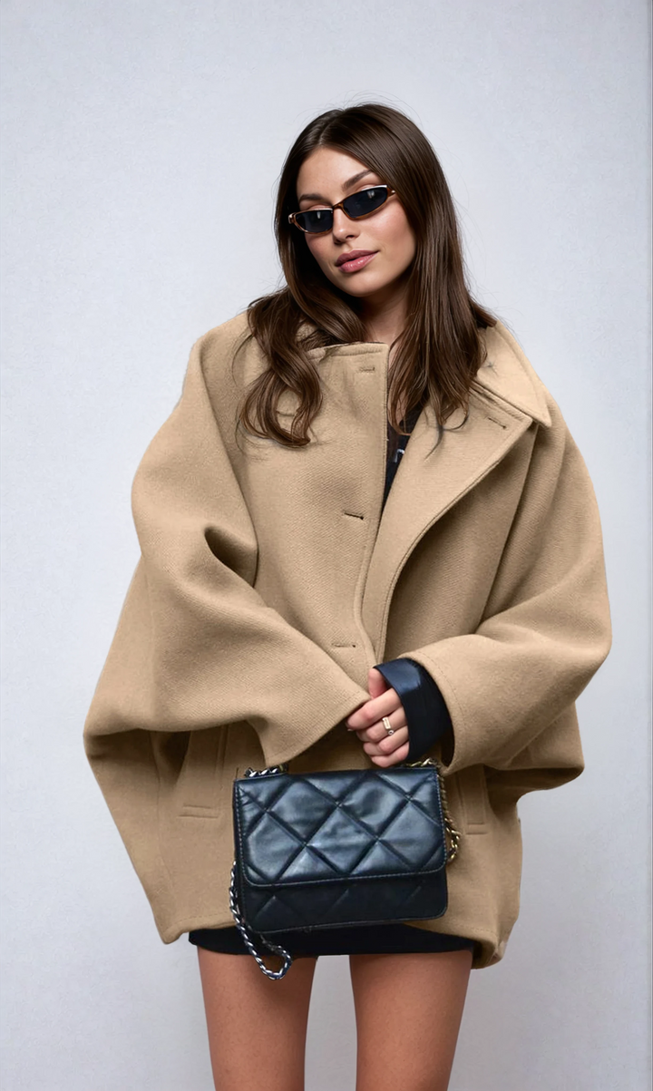 Chic women's oversized long coat with button closure. Perfect relaxed fit outerwear for fall & winter fashion.