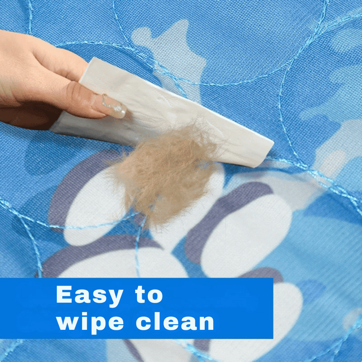 "Pale blue pet cooling mat on beige sofa provides comfort for dogs and cats during summer, featuring self-cooling ice silk fa