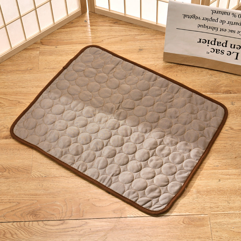 "Pet cooling pad in light blue, ideal for summer. Features breathable, machine-washable fabric, available in multiple sizes."