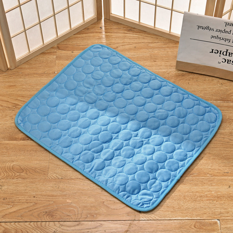 "Pet cooling pad in light blue, ideal for summer. Features breathable, machine-washable fabric, available in multiple sizes."