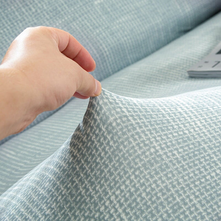 "Pistachio solid colour sofa cover, vibrant protective slipcover fits various sofa sizes, adds edgy style to living room."