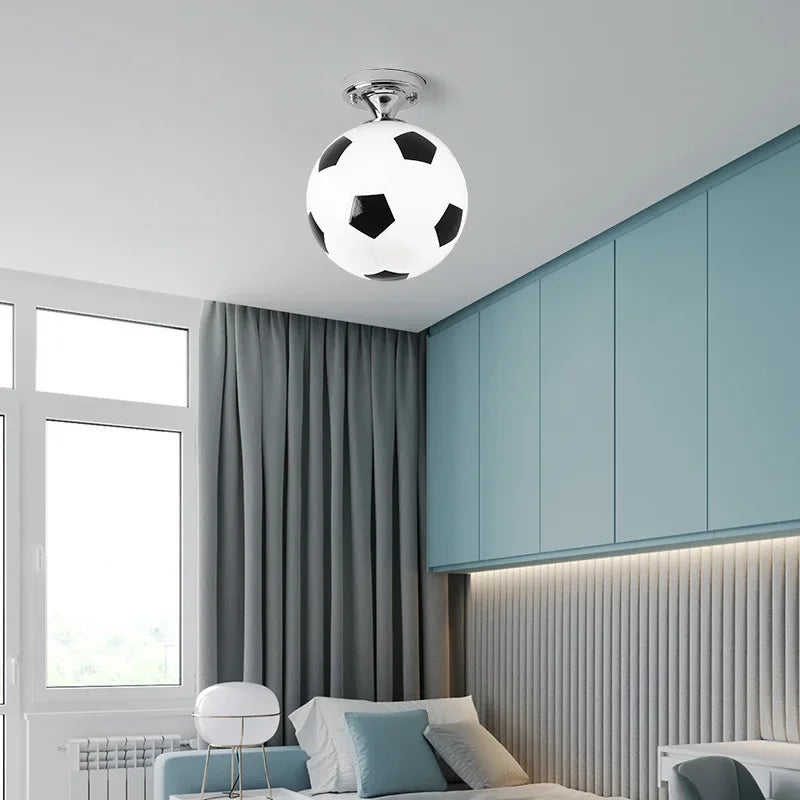 Playful Kids' LED ceiling light with football & basketball designs, perfect for a sports-themed children's room.
