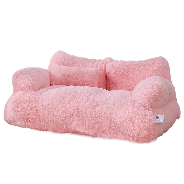 "Plush dog sofa bed in beige, features raised edges for security, soft cushioning for comfort, available in versatile sizes."
