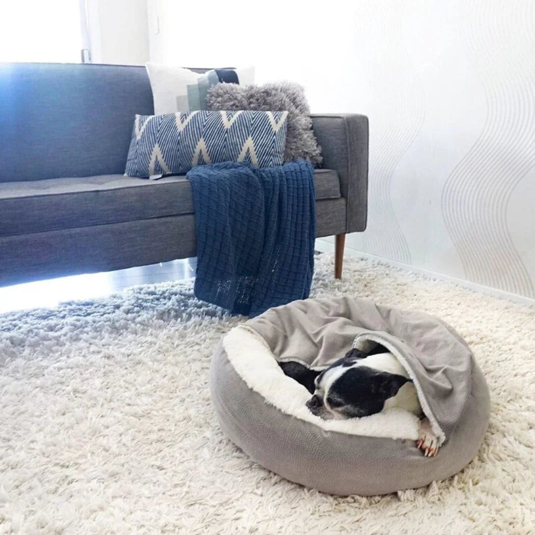 "Plush faux fur pet cave bed for cats and dogs, beige color, offering cozy comfort and security with orthopedic support."