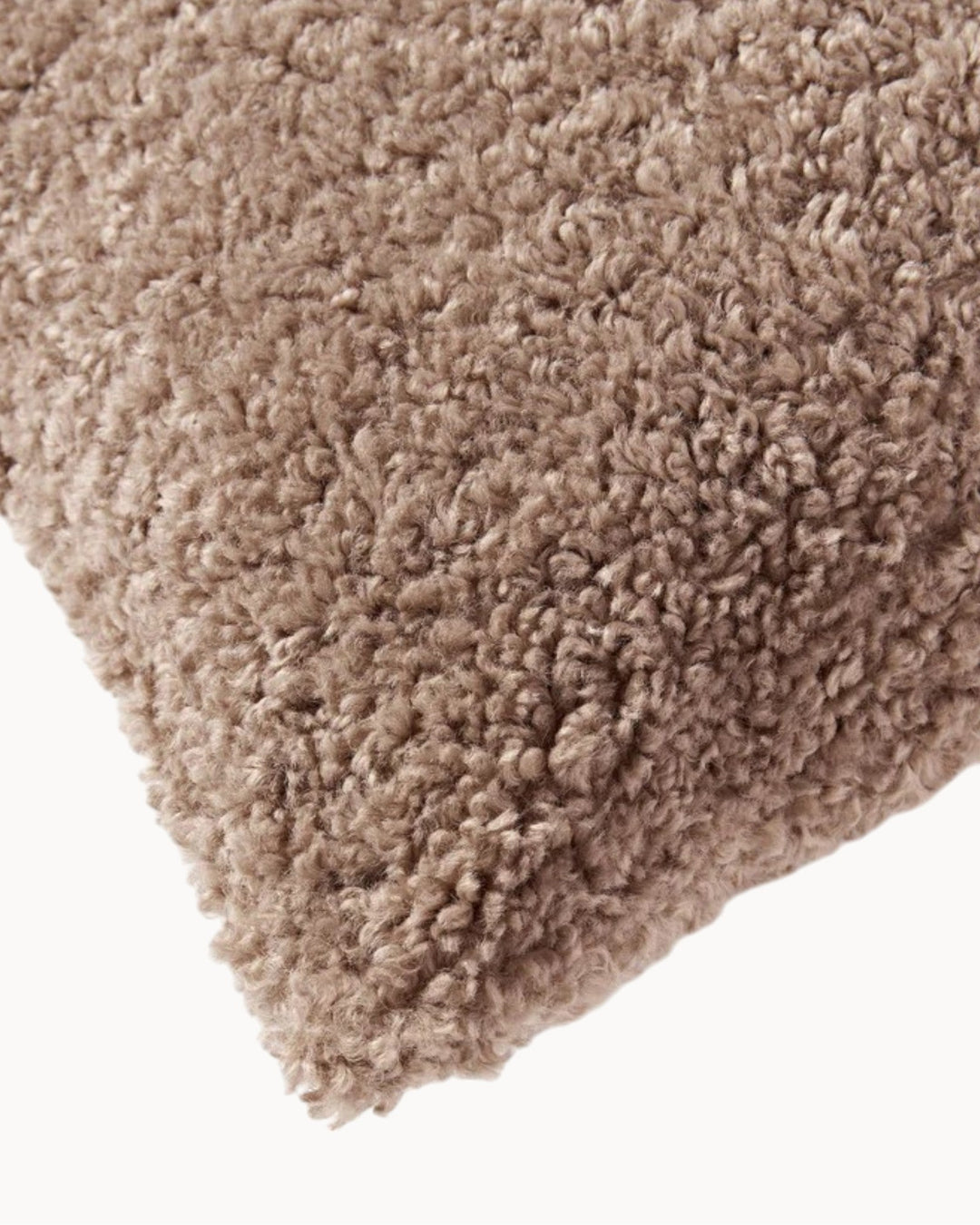 Inviting plush teddy cushion cover. Fluffy throw pillow bringing soft, cozy home decor to life.
