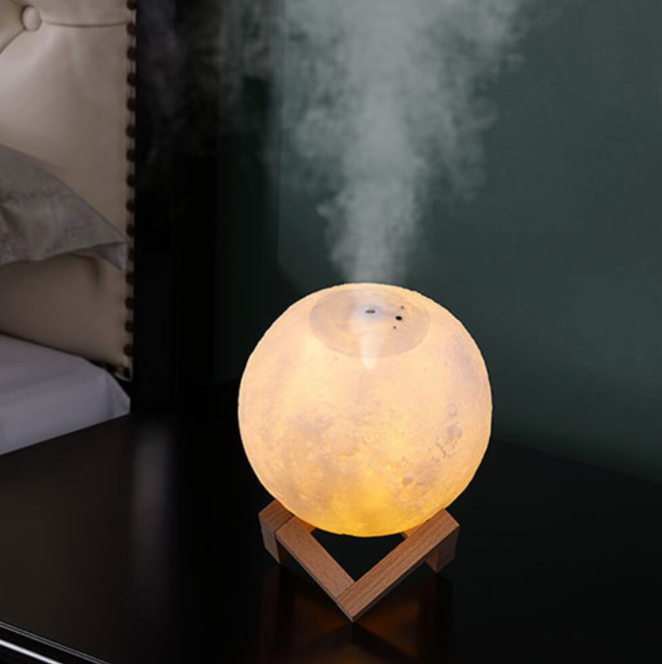 Portable air purifier & humidifier with a glowing moon lamp, enhancing home comfort & bedroom decor.