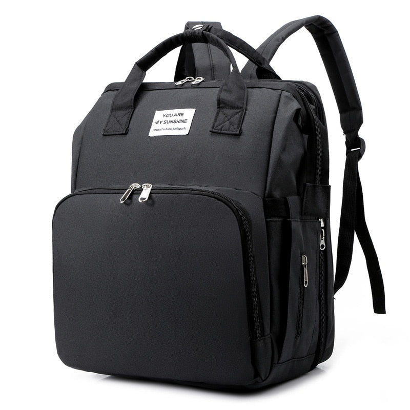 Portable baby bed & changing station travel backpack, ideal for on-the-go parents.