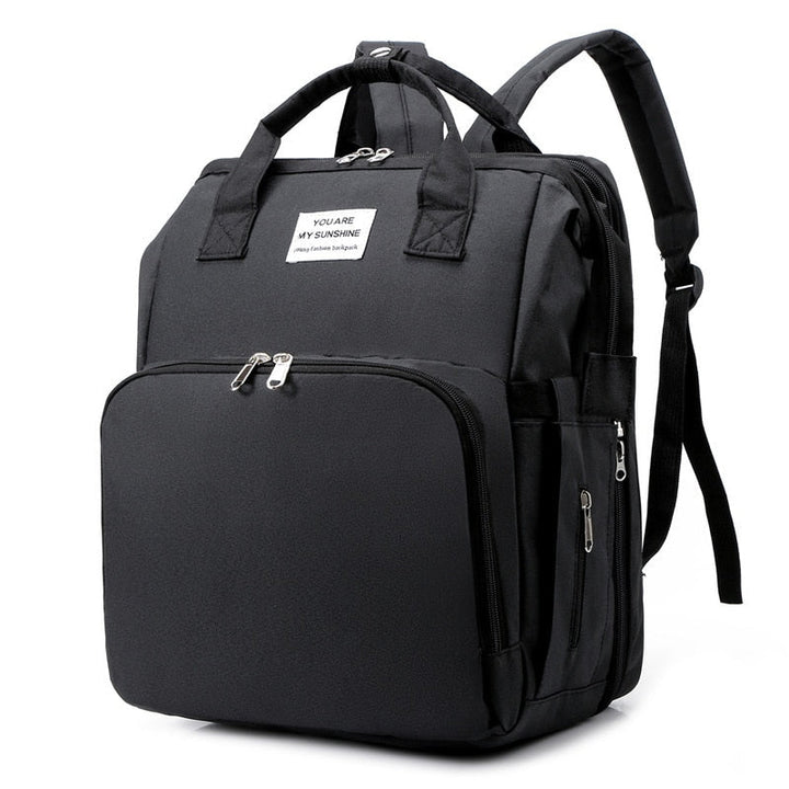 Portable baby bed & changing station travel backpack, ideal for on-the-go parents.