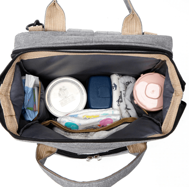 Functional travel backpack for babies, offering a changing station & portable bed.