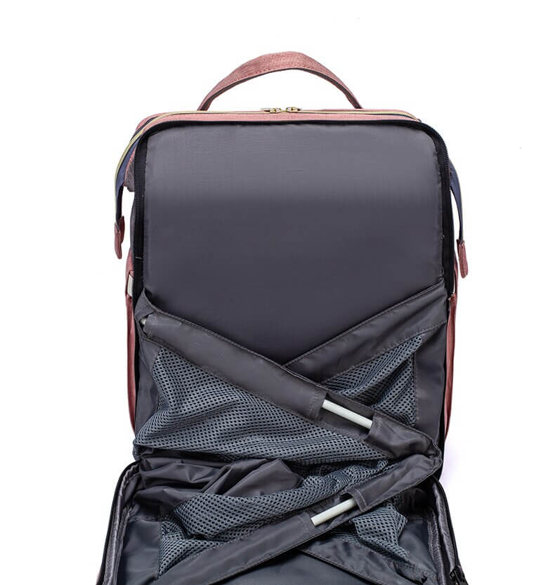 Side view of the Parent's Portable Baby Bed & Changing Station Travel Backpack.