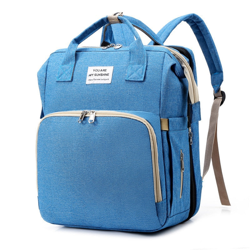Multi-function baby changing bag and portable bed for convenient baby travel.
