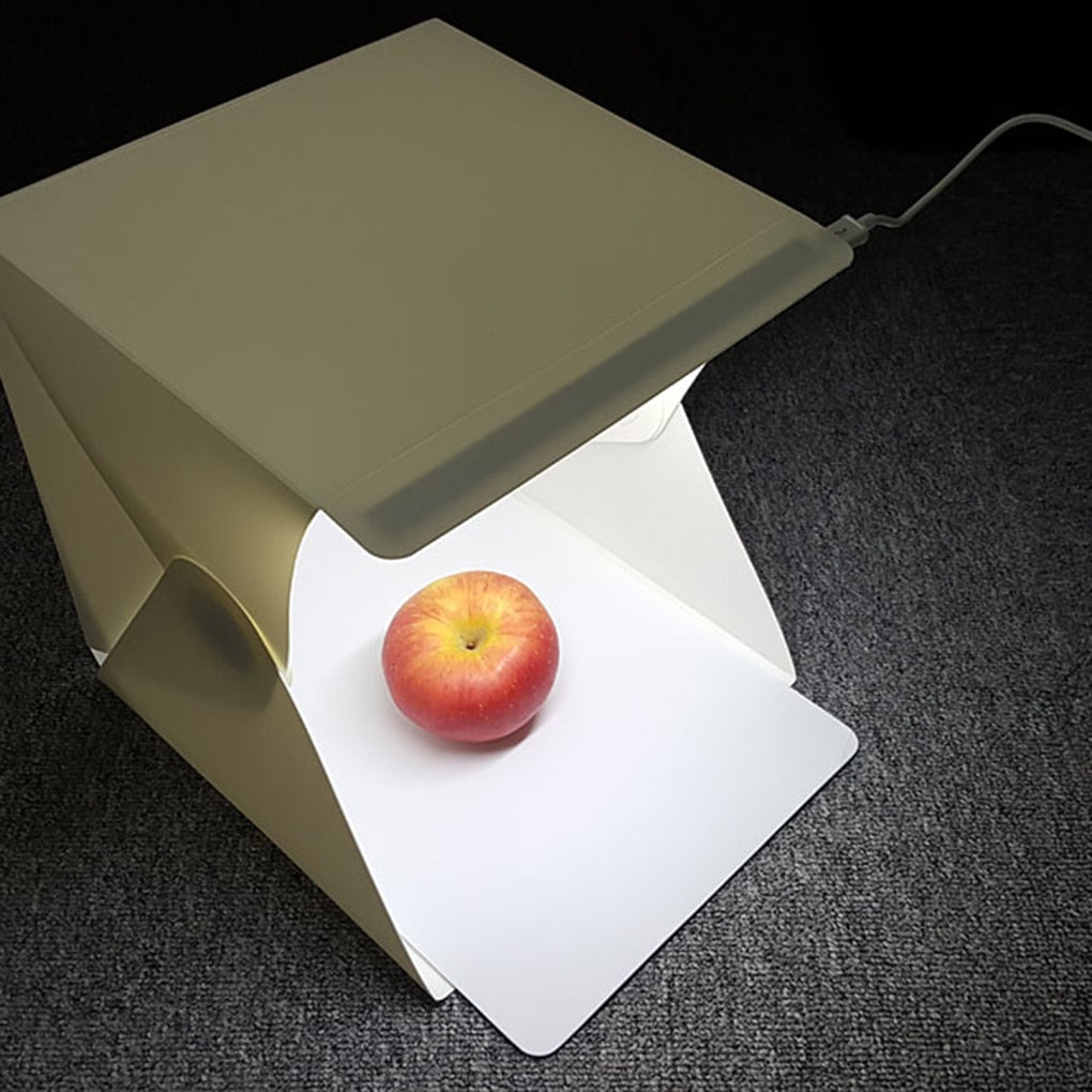 Foldable photo studio light box with bright LED lighting for crisp, professional product photography.
