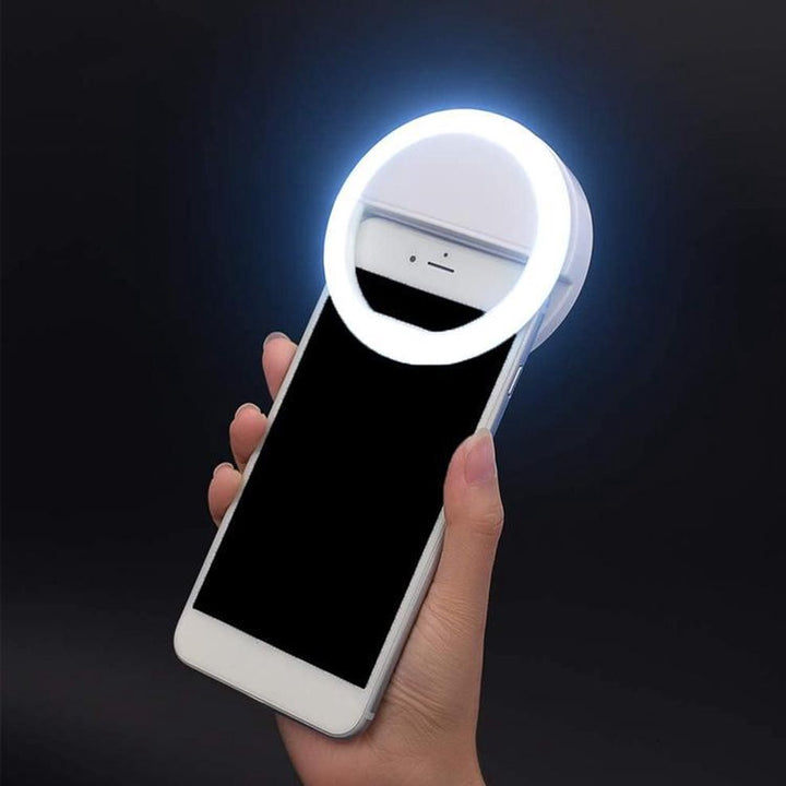 Portable LED selfie ring light, perfect for bright photography & video clips on phones.