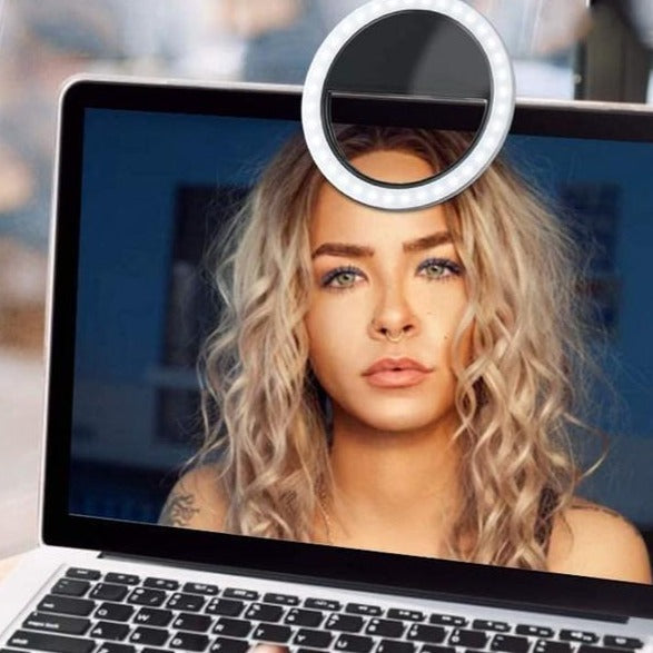 Rechargeable portable LED ring light, illuminates faces for clearer video calls & online meetings.