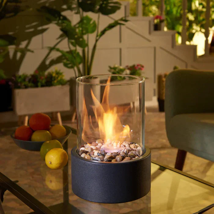Portable tabletop fire pit creating cozy indoor & outdoor ambiance, ideal for modern home decor and patio living.