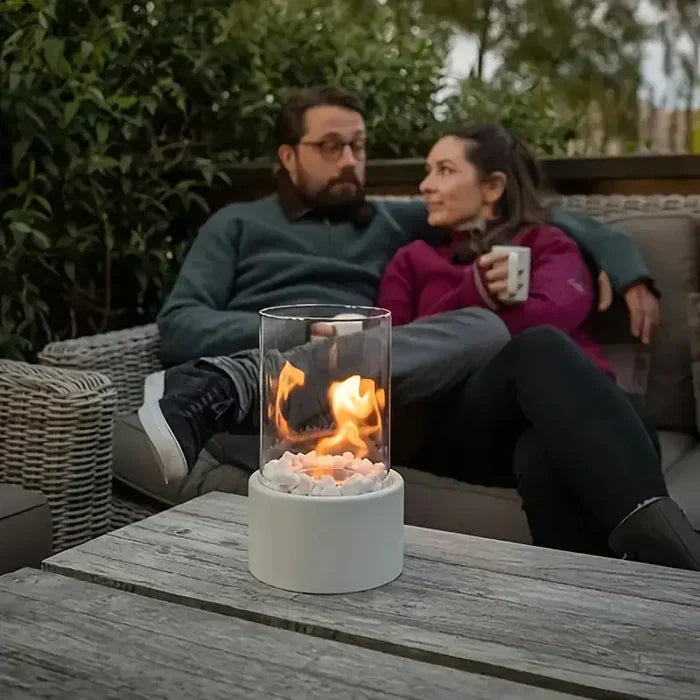 Chic indoor tabletop fire pit, a modern design flame lantern adding a warm glow to any home decor setting.