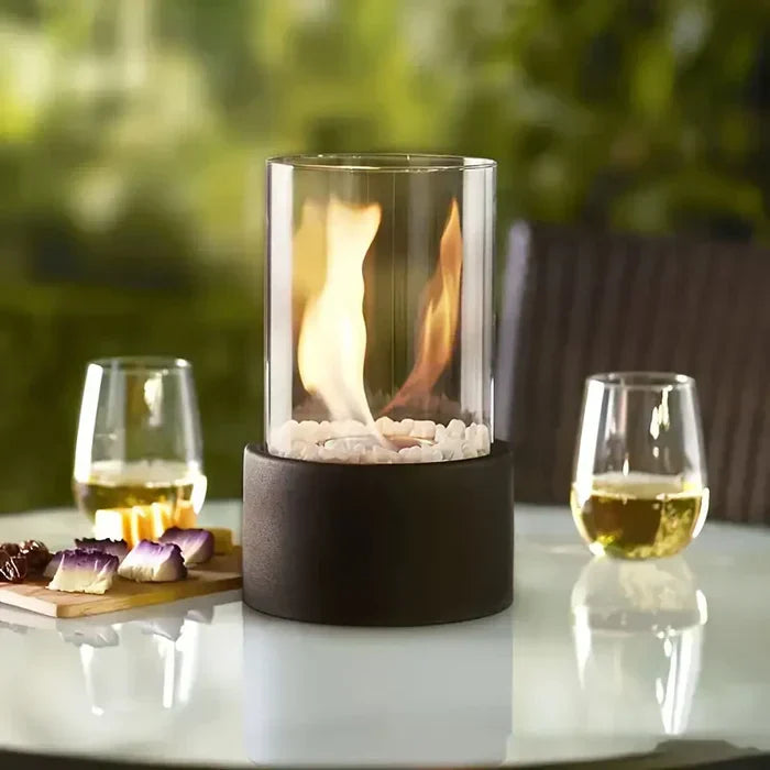 Safe & stylish tabletop flame lantern, a portable fire pit enhancing modern home decor and outdoor ambiance.