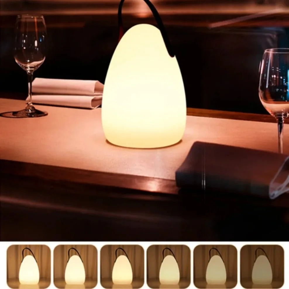 Portable waterproof cordless lamp with remote control, sleek modern design, suitable for indoor and outdoor lighting.