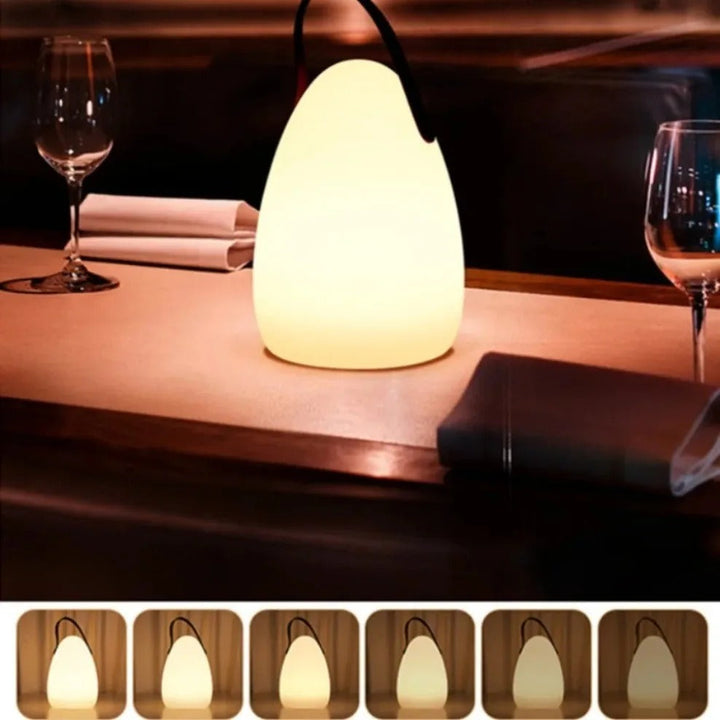 Portable waterproof cordless lamp with remote control, sleek modern design, suitable for indoor and outdoor lighting.