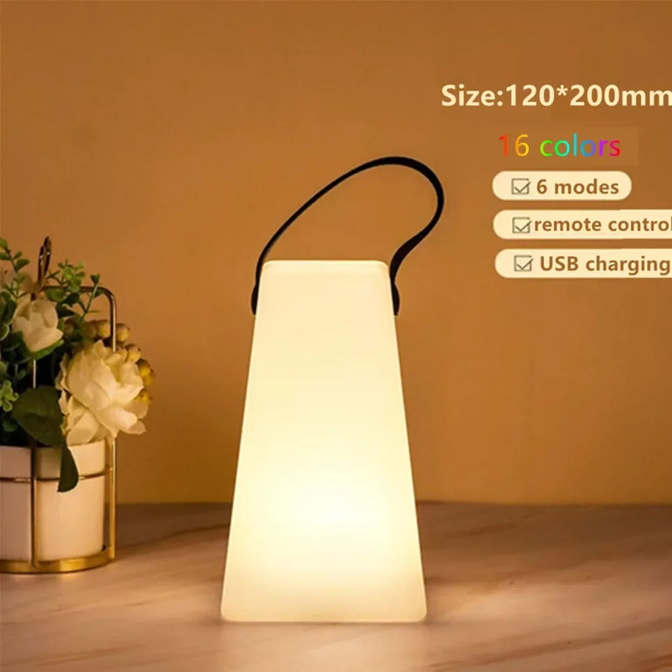 Portable waterproof cordless lamp with remote control, sleek modern design, suitable for indoor and outdoor lighting.