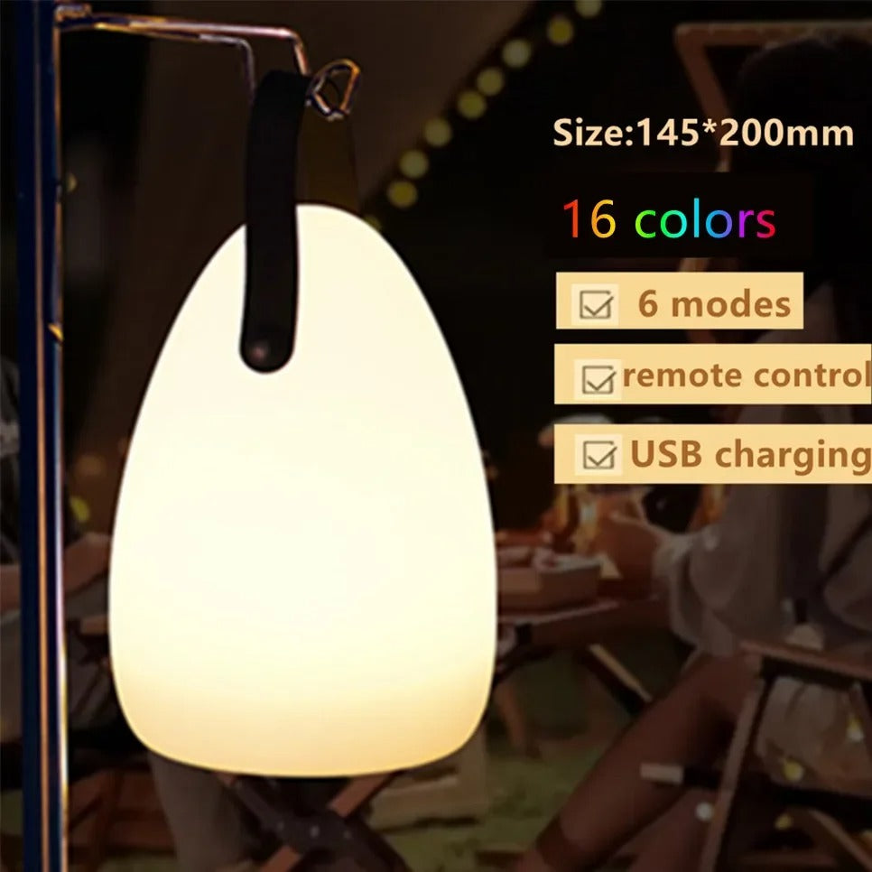Portable waterproof cordless lamp with remote control, sleek modern design, suitable for indoor and outdoor lighting.