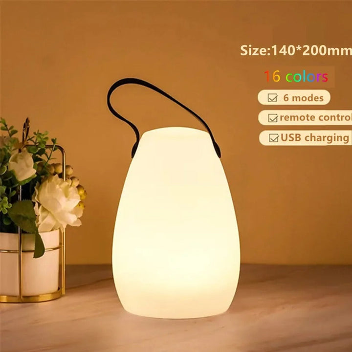 Portable waterproof cordless lamp with remote control, sleek modern design, suitable for indoor and outdoor lighting.