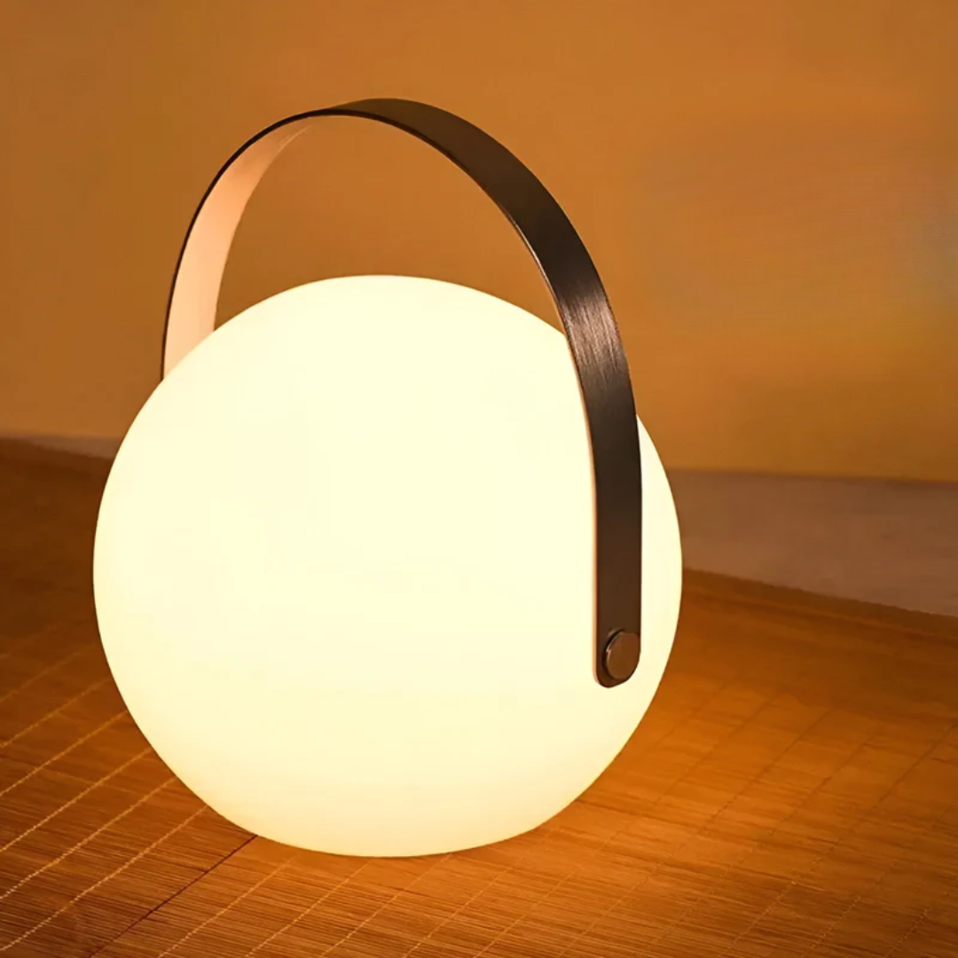 Modern wireless LED table lamp, waterproof, rechargeable, ideal versatile lighting for indoor & outdoor spaces.