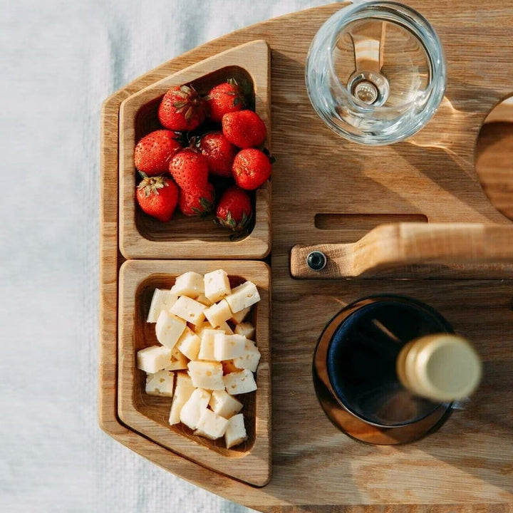 Portable wooden picnic wine table. Foldable design for outdoor dining, snacks, and entertaining.