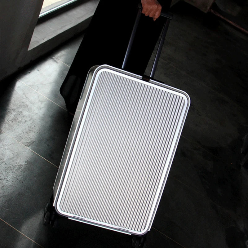 Unisex aluminum spinner luggage, hardshell, with smooth rolling wheels for easy travel.